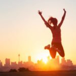 sport women jumping and celebrating with arms raised picture id949262042